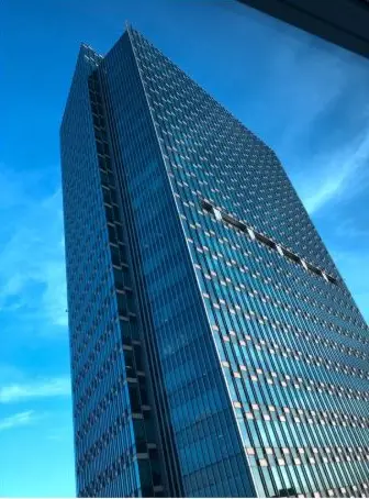 A glass tower against the blue