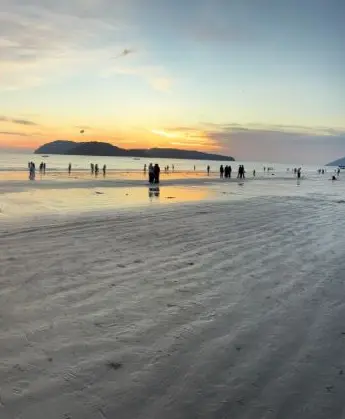 Sunset on the wet sand